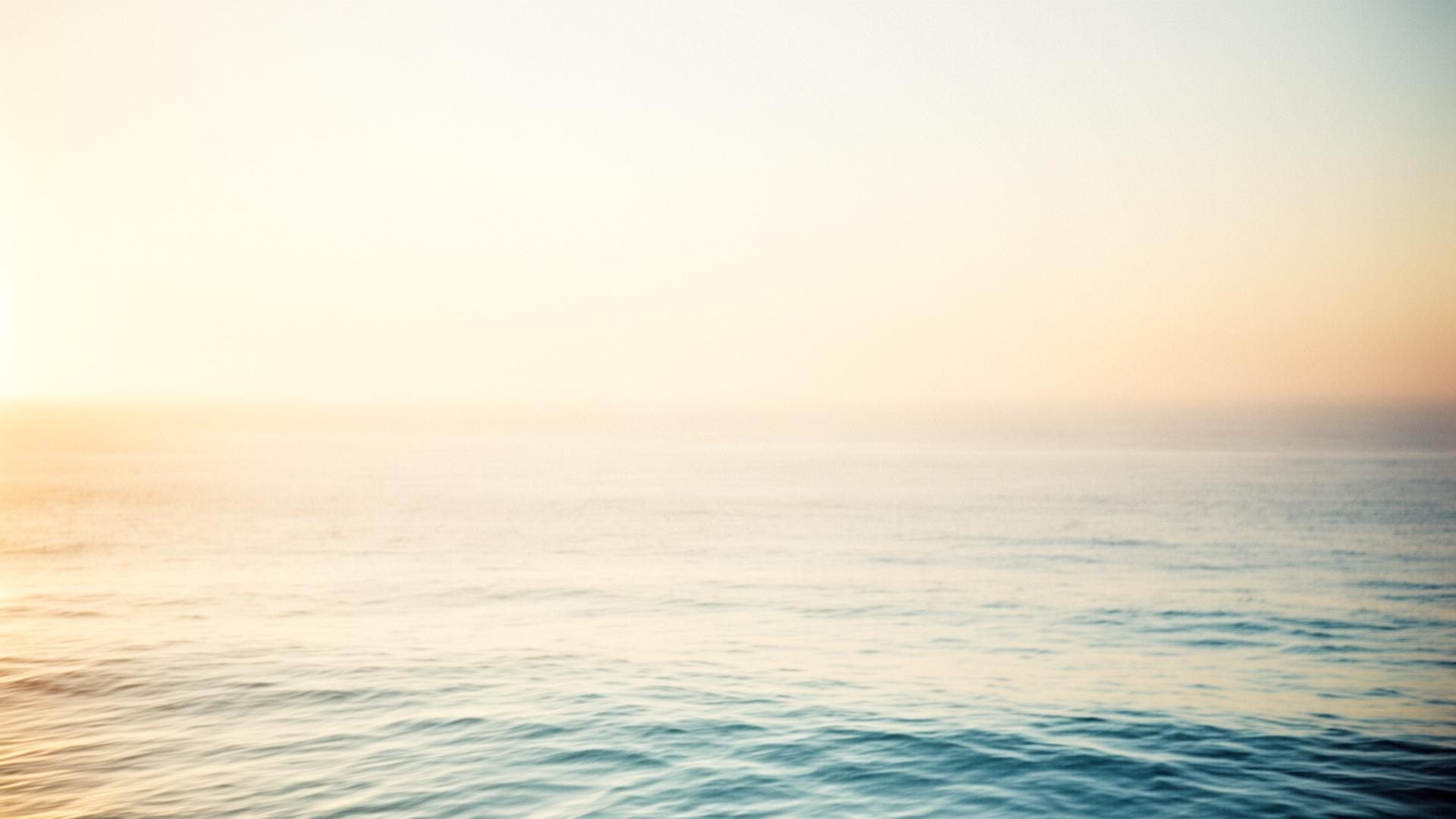 Calm ocean horizon at golden hour